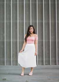 Forever 21 off-the-shoulder bodysuit | Aritzia white pleated midi skirt