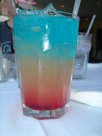 Bomb Pops!! 2 oz Bacardi Razz rum, 2 oz lemonade, 2 oz Blue Curacao. It tastes just like the popsicle!