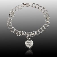 The Amour Cremation Charm Bracelet is made of the finest sterling silver. This beautiful bracelet features a double link chain and a cremation charm that is personalized with handwritten text. The charm can be further personalized on the back with engraved text. The small compartment within the charm can hold a small amount of remains or any similar memento, such as crushed flower petals or earth from a special place.