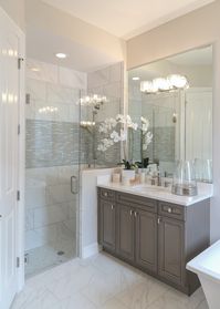 Another option is not framing the mirror, but taking it up all the way to the ceiling and installing lights on top of it. This is a very elegant look that can make a bathroom feel open and airy.