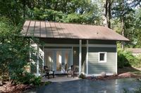 This garage was converted into a 340 sq. ft. tiny cottage with an upstairs loft by ART Design Build. When you go inside you’ll find an open living area that converts into a bedroom with the u…