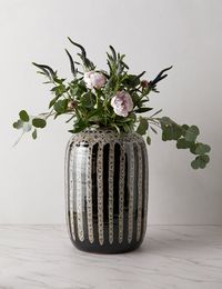 Set the tone for dramatic appeal with this vibrantly striped vase. Shop this bold decorative vase for your living space or entryway.