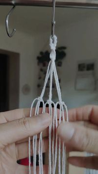 Mini macrame plant hanger car charm in the making with faux eucallyptus sprig. Perfect for displaying on your car rear view mirror | That Knot Place