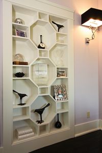 Remove some of your old shelving and ask a cabinet maker to insert a few hexagon patterns. Top it off with a fresh coat of paint.