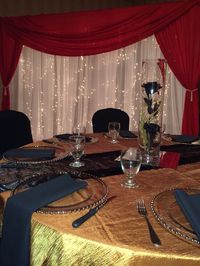 Phantom of the Opera theme decor #parisoperahouse #phantomoftheopera ##lethbridgeeventrentals #lethbridgeevents #events #decor #rose #roseball #ball #reception #red #gold #stage #backdrop