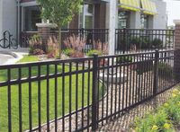 Add landscaping around fence to make it easier to mow around.. add some pretty plants/flowers to make it more appealing.