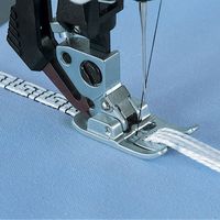 Wonderful decorative embellishments are easy with this special foot. You can sew up to 9 different lengths of embroidery floss, pearl cotton or high sheen threads in place with your choice of a decorative or utility stitch. The multi-cord foot is used to sew down several small cords (such as elastic or silk thread) at once with a wide or decorative stitch. This foot has a series of holes in front of the needle opening to feed the cord through avoiding slipping or tangling as you sew Pfaff 7/9 Ho