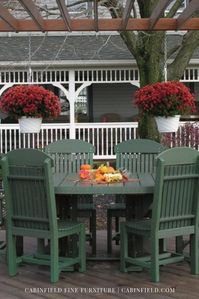 Low-maintenance poly furniture is ideal for #outdoor #dining, and this Amish patio set boasts an oval table, two captain’s chairs, and four side chairs. Seating is more comfortable with optional outdoor cushions and a protective patio umbrella. Offered in dining, counter or bar height, this #patio #dining set is available in black and white color schemes, bold solid colors or attractive two-tone color combinations.