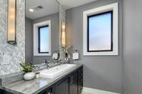 Bathroom Design. Modern Craftsman style home was built from the bones up. Double Island, Hidden Cookie Kitchen / Pantry with false brick wall, Hidden Hood, La Cantina Doors open completely and seamlessly to allow indoor-outdoor flow. There are fireplaces both indoor and outdoor, as well as firepit/table combo in the outdoor space. #craftsmanstyle #bathroom #guestbathroom #bathroomdesign #interiordesign