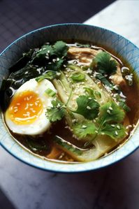 A warming chicken soup for winter full of miso, soy, ginger and garlic, plus there's rice in there too to fill you up - it's comfort food in a bowl especially thanks to that lovely jammy soft boiled egg | food photography ideas