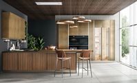 Slatted walnut canaletto brass thread | Brass oxidized liquid metal | Walnut canaletto | Worktop: Gres Laminam | Groove and plinth: Titanium