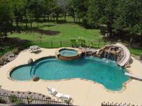 Swimming Pool, Slide, Diving Board, Hot Tub, and Waterfall... What more could you want?