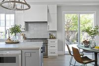 This stunning Modern Farmhouse is a family friendly home not lacking in sophistication or elegance. This home features Signature Custom Cabinetry throughout, with captivating light fixtures perfect for every space. #kitchenideas #modernfarmhouse #kitchenlighting #islandlighting #kitchenlightingideas