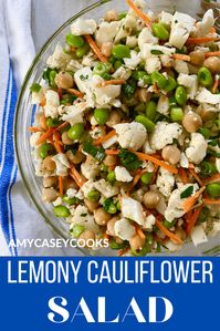 Lemony Cauliflower Salad with Edamame and Chickpeas. This is my favorite crunchy salad! It's loaded with raw cauliflower, chickpeas, edamame, carrots, scallions, and tossed with a lemony mustard vinaigrette. You can't help but feel good after eating this healthy cauliflower salad. #healthysalads #cauliflowersalad