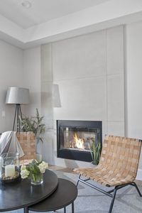 This stunning Modern Farmhouse is a family friendly home not lacking in sophistication or elegance. This home features Signature Custom Cabinetry throughout, with captivating light fixtures perfect for every space. #kitchenideas #modernfarmhouse #fireplace #stone #homeinterior #fireplaceideas