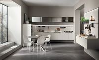 The exclusive side handle detail - easy to grip like in a professional kitchen - proposed in a high-end brass finish, illuminates this compact wall-mounted Prestige white matt lacquered composition. The perfect blend of materials, along with the clear stopsol glass wall units, to create a practical, stylish space.