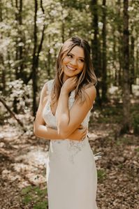 A form-fitting crepe wedding dress with a lace bodice for your dreamiest of weddings and elopements.