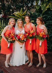 Bright colored Bridesmaids dresses for a spring beach wedding! Check out more from this wedding by Rad Red Creative. Tampa Bay and St. Pete Wedding Photographers. #bridesmaids #bridesmaiddresses #springwedding #beachwedding #tropicalwedding #floridawedding #destinationwedding #destinationweddingphotographer #stpetebeachwedding #tradewindswedding