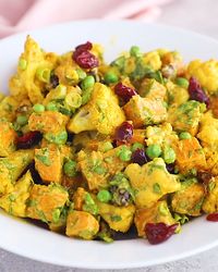Vegan and gluten free curry roasted cauliflower sweet potato salad with a creamy curry tahini dressing. This salad is everything you could ever want. Easy to make, packed with veggies and absolutely addicting! #veganrecipes #healthylunch #lunchideas #sweetpotatoes #whole30recipes #dairyfree #glutenfreerecipes #saladrecipes