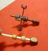Glue beads to make a tiny weather-vane!