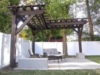 unique pergola shape. would look great with vines