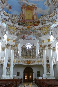 Wieskirche, Bavaria, Germany. The Pilgrimage Church of Wies is an oval rococo church, designed in the late 1740s by Dominikus Zimmermann, who for the last eleven years of his life lived nearby. It is located in the foothills of the Alps, in the municipality of Steingaden in the Weilheim-Schongau district, Bavaria, Germany.