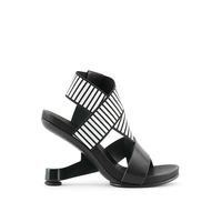 The Eamz Sandal is a slip on sandal with a strappy upper. The silicon printed elasticized straps and molded leather footbed offer a comfortable fit. The heel is inspired by the classic Eames lounge chair - an icon of Modern design. Standard Fit Heel Height: 100mm/4in Nappa leather and elastic upper Leather lining Rubbe