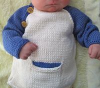 Free Knitting Pattern for Baby Baseball Tee With Mittens - This two-color pullover inspired by baseball jerseys has a convenient front pocket for binkies and buttons at the collar for easy dressing. Size 3 Months. Pictured project by Shanamama. Excerpted on Canadian Living from Knit 2 Together: Patterns and Stories for Serious Knitting Fun by Tracey Ullman and Mel Clark.