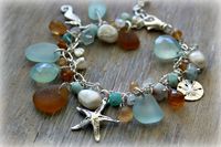 Sea Glass Charm Bracelet with Sand dollar, Starfish , and Seahorse Charms. $79.00, via Etsy. #seaglass
