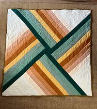 Finished Adventureland baby quilt by Suzy Quilts using Fabelism’s Woven Sprout line and Rifle Paper Co on the back : modernquilts