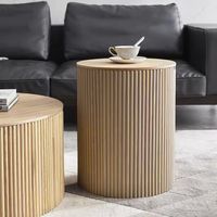 This sophisticated coffee table will make a statement in both contemporary and classic interior decor. This coffee table is a tall one, featuring a wooden base covered, and a circular top made of wood.