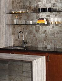 The subtle metallic finishes of Ann Sacks’s Lux travertine tile collection strike a perfect note of subdued glamour. Shown in pewter, the tiles are also offered in silver or gold. The mosaic tile on the backsplash costs $58 per sq. ft., and the tile on the bar front is $45 per sq. ft. annsacks.com, 800-278-8453
