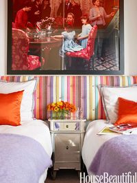 A long headboard in Brisbane by Missoni unites twin beds.