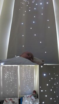 Use simple black out roll blind and cut shapes out. Makes daytime naps feel like night time stars.