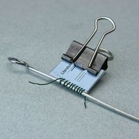 Clever technique using skewer to make a wire spiral binding for a mini book #coil #bindings #techniques