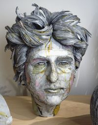 Scott Fife sculpts with archival cardboard, an Xacto knife, drywall screws, a screw gun, and glue.