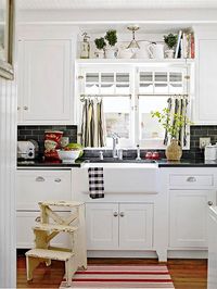 10 Ideas for Decorating Above Kitchen Cabinets | Not sure what to do with that awkward space above your kitchen cabinets? Check out these 10 stylish solutions for decorating above kitchen cabinets. | TheCasaCollective.com | #interiordesign #decoratingabovecabinets #kitchens