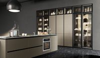 Base cabinets fronts: Burnished bronze lacquered brushed metal effect and earth grey stained | tall cabinets fronts and above columns: Burnished bronze lacquered brushed metal effect and black aluminum frame smoked glass | Upper cabinets fronts: Earth grey stained | Snack table: Earth grey stained | Worktop: Stainless steel | Groove and plinth: Titanium