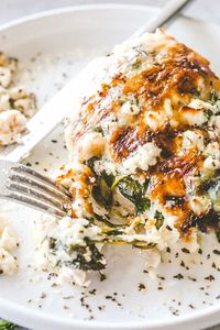 Cheesy Chicken Spinach Bake - Tender baked chicken breasts topped with creamy spinach and melty cheese. A one-pot low carb dinner that's perfect for those busy weeknights!