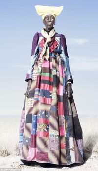 Herero woman in patchwork dress. Anthropologists believe the dress of the Herero tribe is a subversion of their former rulers' fashion. This practice harks back to how the tribe survived efforts by German colonists who sought their destruction. (Daily Mail)