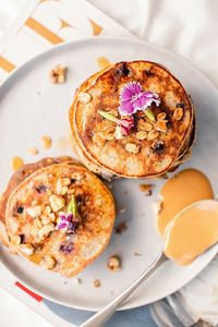 Healthy Peanut Butter, Blueberry, Banana & Walnut Pancakes Growing up in South Africa, we used to call pancakes “flapjacks”. This recipe is a fun spin on my classic oat & banana pancake recipe (from this video). I love having it with just a drizzle of maple syrup on top! Calories: roughly 460 (vegan alt 360…