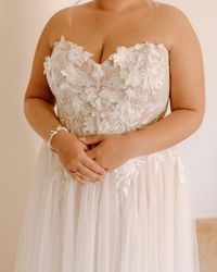 Strapless A-line 3D Lace Tulle Wedding Dress Mirra by Maggie Sottero. Click to find this gown! . . . . #straplessweddingdress #alineweddingdress #3dlaceweddingdress #laceweddingdress #tulleweddingdress