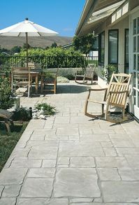 Stamped Concrete patio. Product used: LITHOTEX® Pavecrafters® English Yorkstone pattern, LITHOCHROME® Color Hardener, LITHOCHROME® Antiquing Release. © 2013 L. M. Scofield Company. All rights reserved.