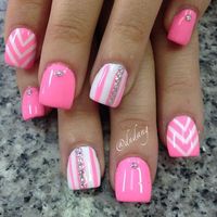 Wonderful looking stripes and zigzag pink nail art design. Using pink and white as base color, the contrasting colors are painted over the base colors as the stripes and zigzags. Additional silver beads are added on top.