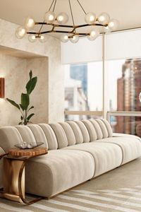 A living room full of light with an all-neutral design that brings even more brightness into the room. The neutral version of our Ocli Geometric Rug completes the look with its minimalist sense and basic colors. A 100% handmade rug made with natural wool and botanical silk.