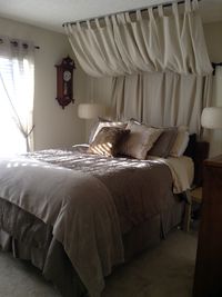 Curtain headboard - perfect to disguise our pipe!