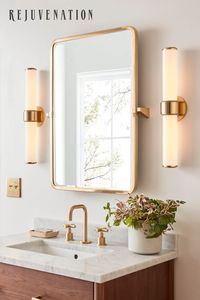 Project Tip: Remember to keep your bath layout in mind when choosing wall sconces. If you have an average-sized medicine cabinet or mirror, place two lights on either side of the mirror at eye level, about 65 inches from the floor and a couple inches from the edge of your mirror. The bottom of the fixture or shade should be at least two inches above the top edge of your mirror. For the ideal visual ratio, look for fixtures that are slightly smaller than the width or height of your mirror.