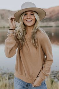 The Sycamore Textured Top is so perfect you'll never want to take it off! This rib knit top features a slight v-neck, long sleeves, and a relaxed fit. The rolled hem on the cuffs and neckline add just the right amount of style to make this piece pop. Available in Tan, Black, and Light Grey