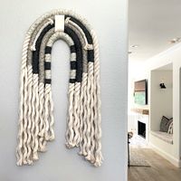 Created using three of our favorite neutral colors, this Ooh La Lm arch is complementary to most spaces. The addition of a warm white leather band and 1/4" rope with fringed ends adds interest and dimension to this beautiful arch. Dimensions: 32" H x 16" W x 1.75" D Weight: 5.5 lbs Finished with a custom wood backing.