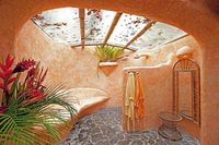 cob house bathroom steel beams made to look like wood strong enough to hold logs and/or stones if need arises